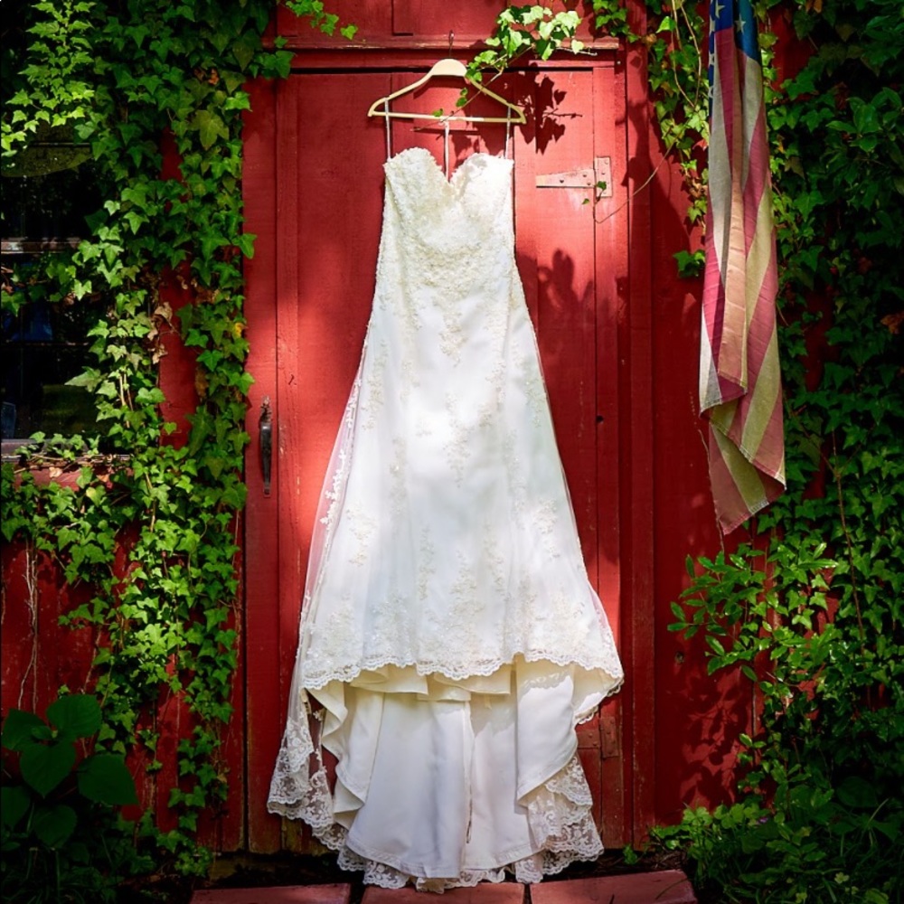 Gorgeous Maggie Sotero dress size 12-16 with adjustable corset back in Ivory.